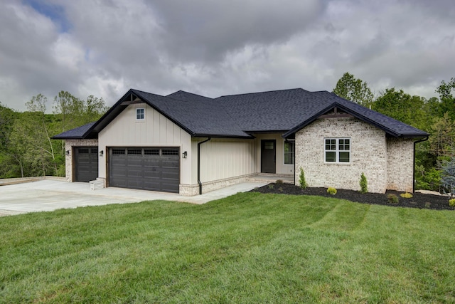 385 Plumtree Dr, Ozark, MO 65721 - view of front of house with roof with shingles, an attached garage, concrete driveway, a front yard, and board and batten siding