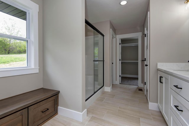 385 Plumtree Dr, Ozark, MO 65721 - bathroom with vanity, baseboards, and a shower stall