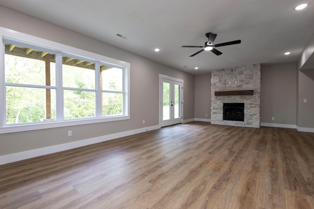 385 Plumtree Dr, Ozark, MO 65721 - unfurnished living room with ceiling fan, baseboards, visible vents, and wood finished floors