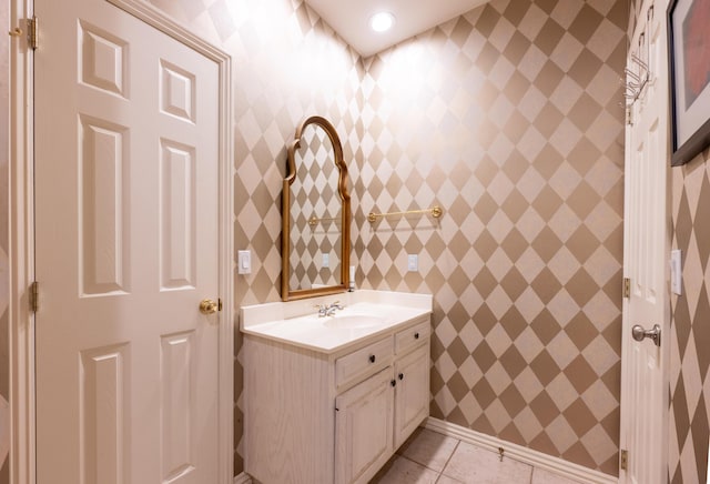 bathroom featuring tile patterned flooring and vanity