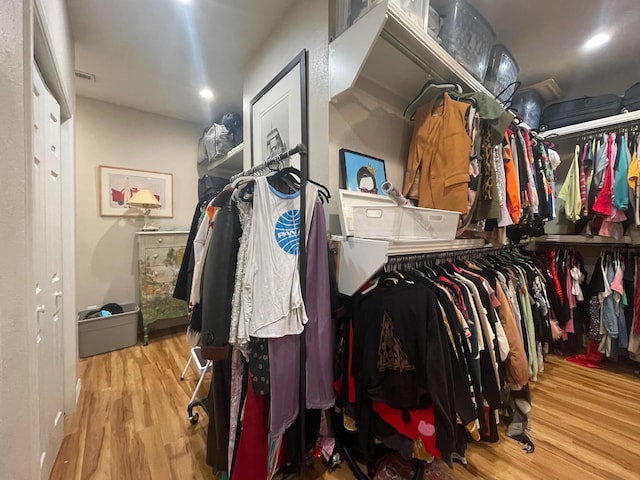 spacious closet with wood finished floors