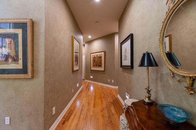 hallway with wood finished floors
