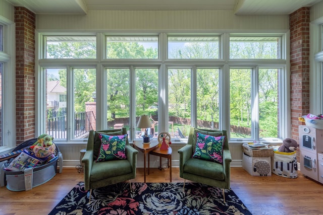 sunroom with wood finished floors