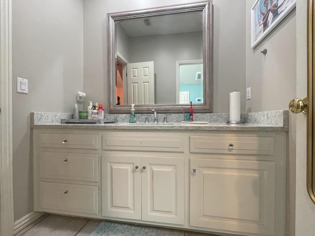 bathroom featuring vanity, visible vents, and tile patterned flooring