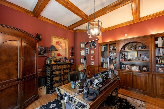 office space with light wood-style floors, a chandelier, beam ceiling, and coffered ceiling
