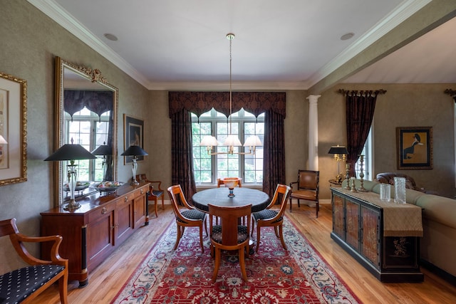 dining area with ornamental molding and light wood-type flooring