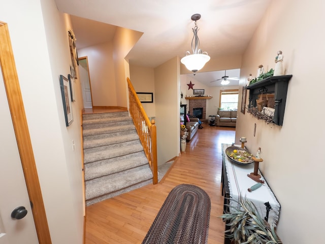 hall with stairway and light wood-style flooring
