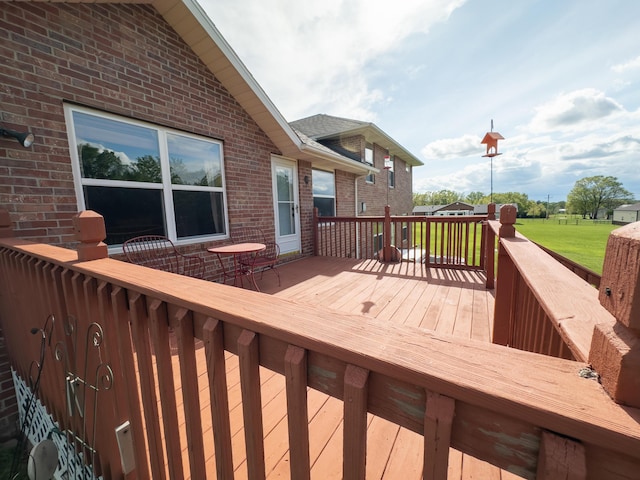 deck featuring a lawn