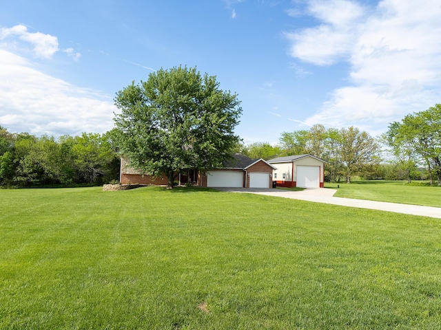 ranch-style home with concrete driveway and a front yard