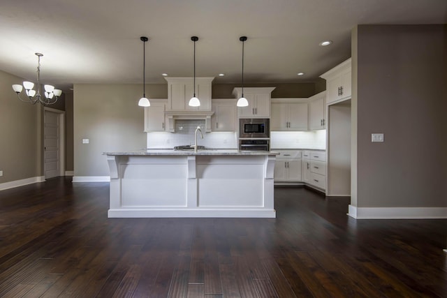 kitchen with backsplash, baseboards, dark wood-type flooring, and appliances with stainless steel finishes