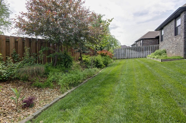 view of yard featuring fence private yard