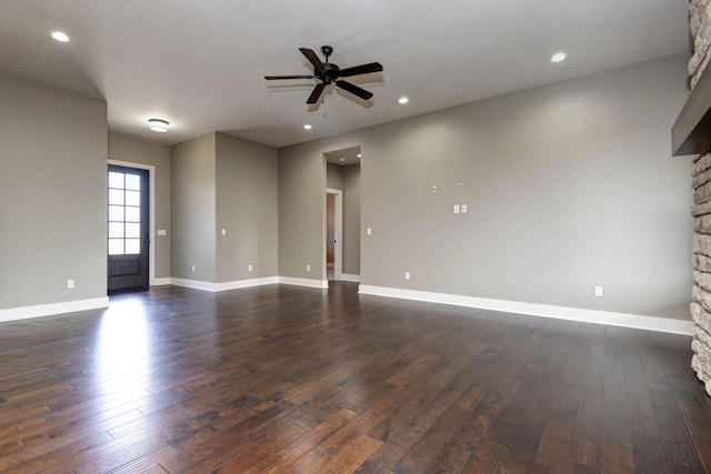 empty room with ceiling fan, baseboards, dark wood-style floors, and recessed lighting