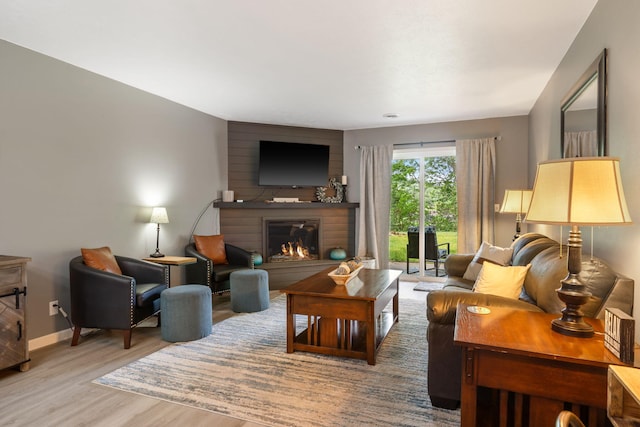 112 Overlook Dr Unit 2, Branson, MO 65616 - living area with baseboards, a large fireplace, and wood finished floors