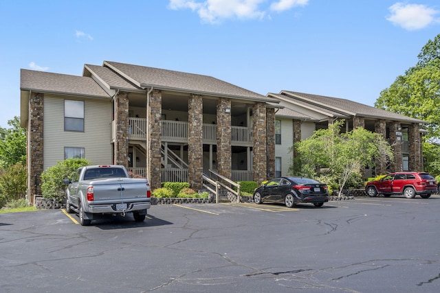 112 Overlook Dr Unit 2, Branson, MO 65616 - view of property with stairway and uncovered parking