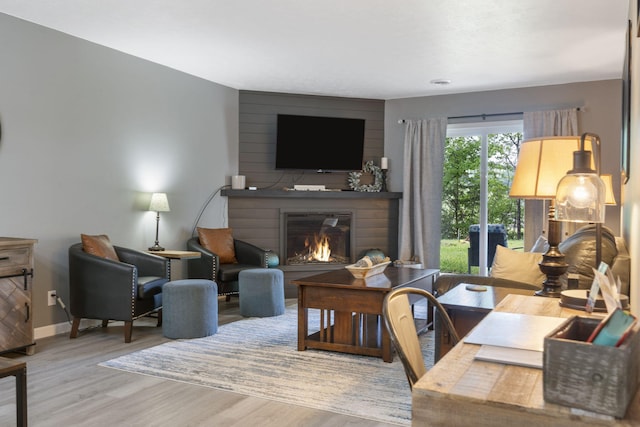 112 Overlook Dr Unit 2, Branson, MO 65616 - living area featuring baseboards, a large fireplace, and wood finished floors