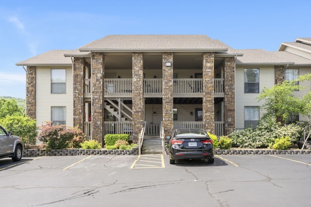 112 Overlook Dr Unit 2, Branson, MO 65616 - view of property with uncovered parking and stairs