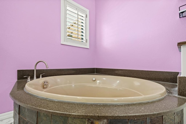 full bath featuring a bath