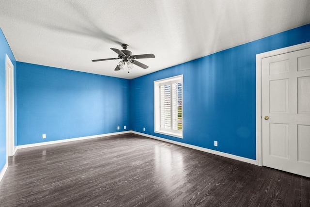 unfurnished room with a textured ceiling, baseboards, a ceiling fan, and wood finished floors
