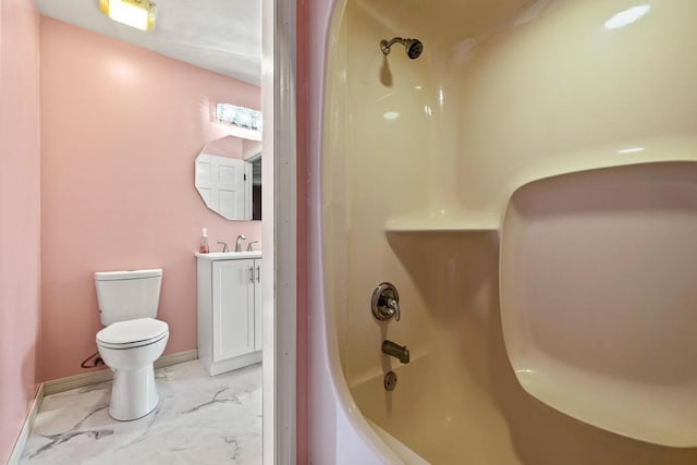 full bathroom with toilet, marble finish floor, baseboards, vanity, and washtub / shower combination