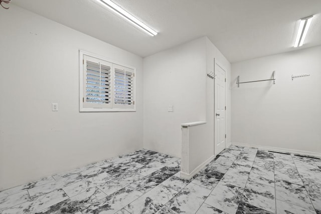 interior space featuring marble finish floor