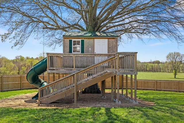 view of play area with a fenced backyard, an outdoor structure, and a lawn