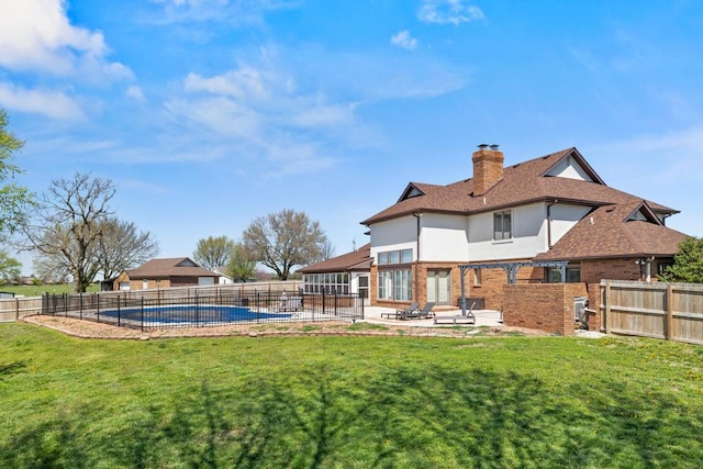 exterior space featuring a fenced backyard, a patio area, and a fenced in pool