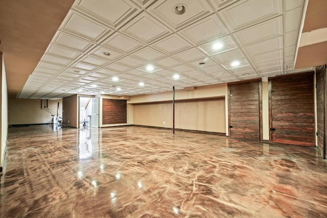 finished below grade area with baseboards, an ornate ceiling, and recessed lighting
