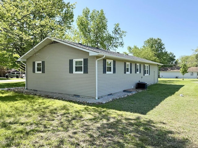 view of home's exterior with a yard, crawl space, and central AC