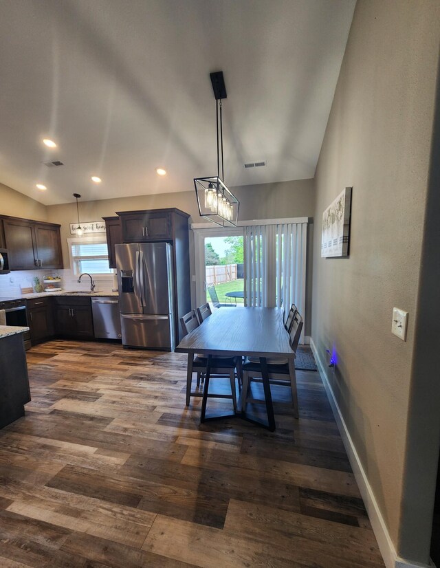 dining area with recessed lighting, baseboards, visible vents, and dark wood finished floors