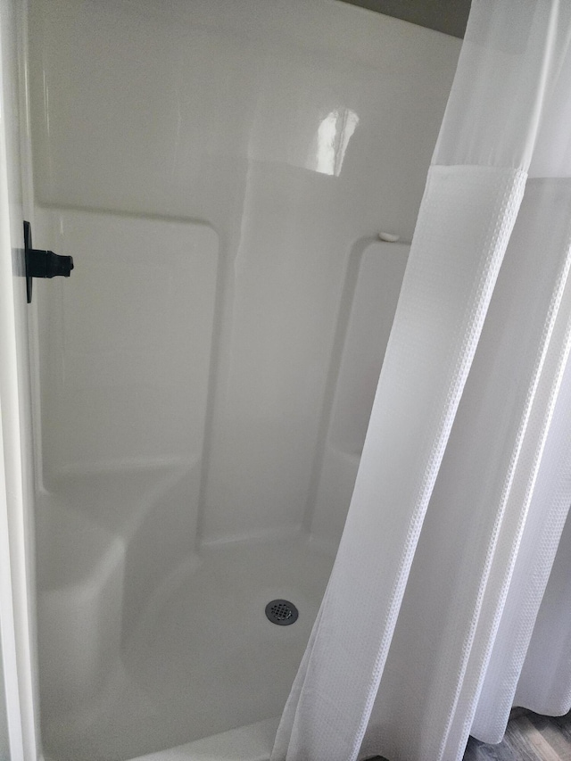 bathroom with a stall shower