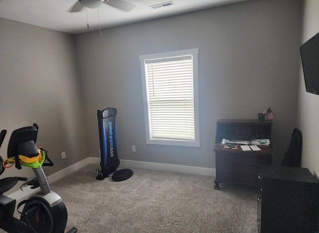 exercise area featuring carpet flooring, baseboards, a ceiling fan, and visible vents
