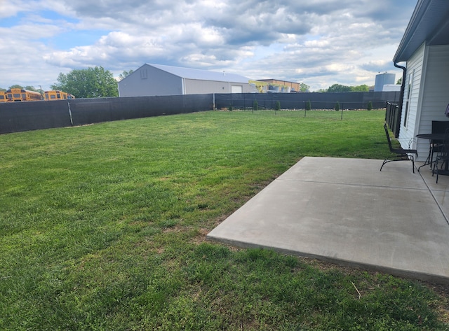 view of yard with a patio area and a fenced backyard