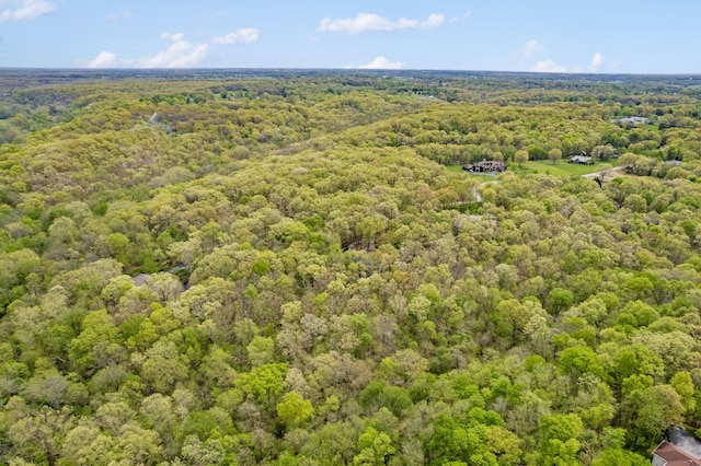 aerial view featuring a view of trees