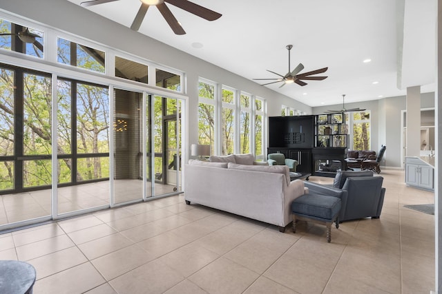 living area with light tile patterned floors, ceiling fan, and recessed lighting