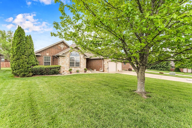 view of front of property featuring driveway, a front lawn, and stone siding