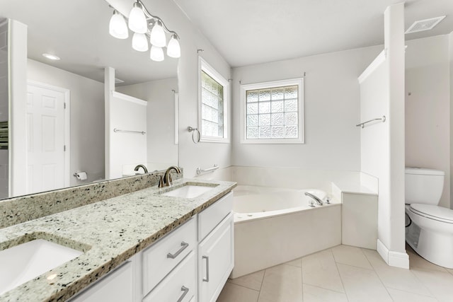 full bath with double vanity, a garden tub, toilet, a sink, and tile patterned flooring