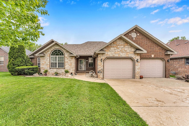 view of front of home featuring an attached garage, stone siding, a front lawn, and concrete driveway