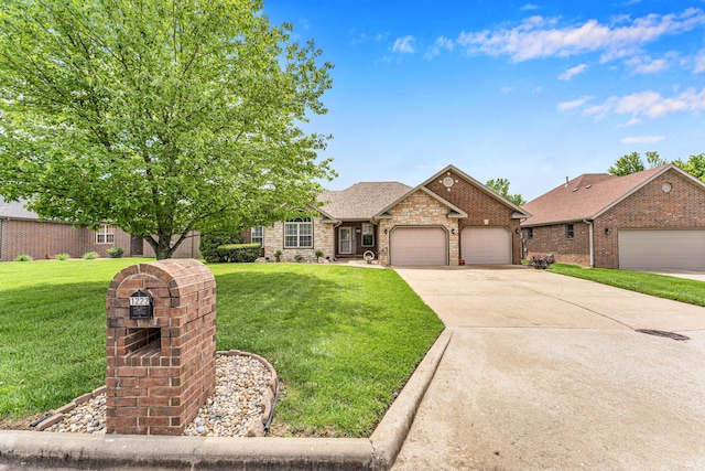 view of front of home with a garage, a front yard, concrete driveway, brick siding, and stone siding