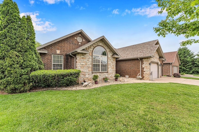 single story home with stone siding, driveway, a front lawn, an attached garage, and roof with shingles