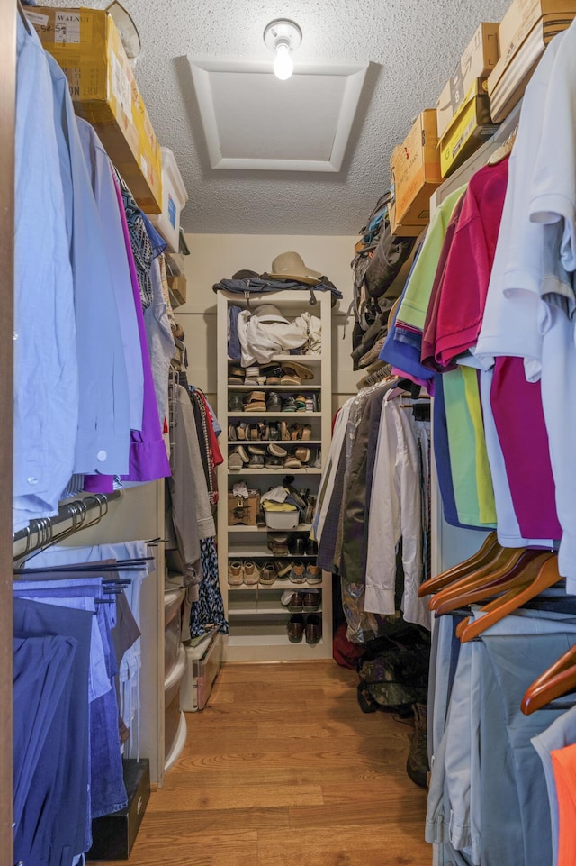 2941 S Versailles Ave, Springfield, MO 65804 - spacious closet featuring attic access and wood finished floors