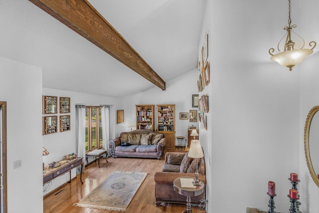 2941 S Versailles Ave, Springfield, MO 65804 - living area featuring lofted ceiling with beams and wood finished floors