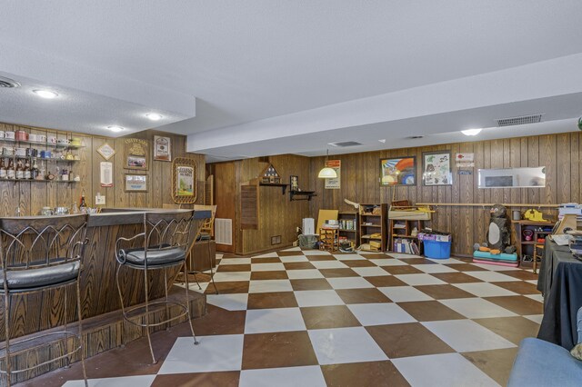2941 S Versailles Ave, Springfield, MO 65804 - bar with a dry bar, wood walls, and visible vents