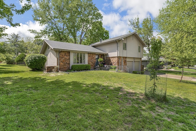 2941 S Versailles Ave, Springfield, MO 65804 - split level home with stone siding, a front yard, driveway, and a garage