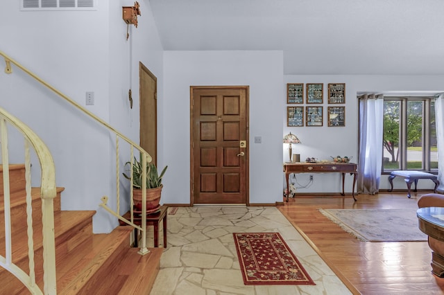 2941 S Versailles Ave, Springfield, MO 65804 - entrance foyer with baseboards, stairway, visible vents, and wood finished floors