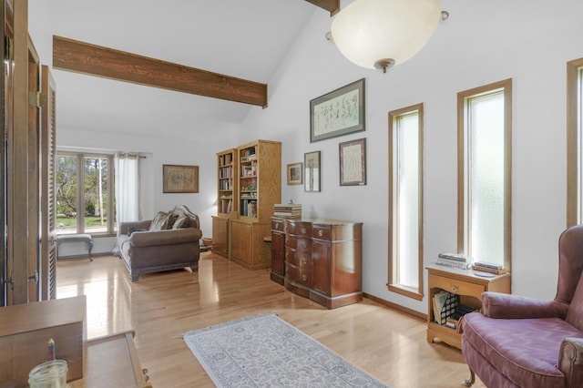 2941 S Versailles Ave, Springfield, MO 65804 - sitting room with high vaulted ceiling, light wood-style flooring, beamed ceiling, and baseboards
