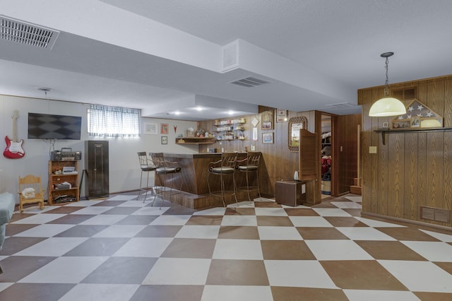 2941 S Versailles Ave, Springfield, MO 65804 - bar with wood walls, indoor bar, and visible vents
