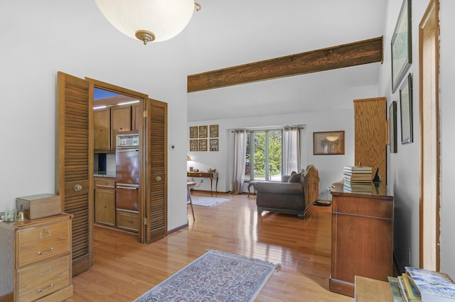 2941 S Versailles Ave, Springfield, MO 65804 - interior space featuring a high ceiling, baseboards, light wood-type flooring, and beamed ceiling