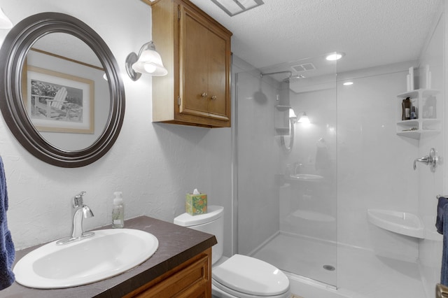 2941 S Versailles Ave, Springfield, MO 65804 - full bath with a textured ceiling, toilet, visible vents, a walk in shower, and vanity