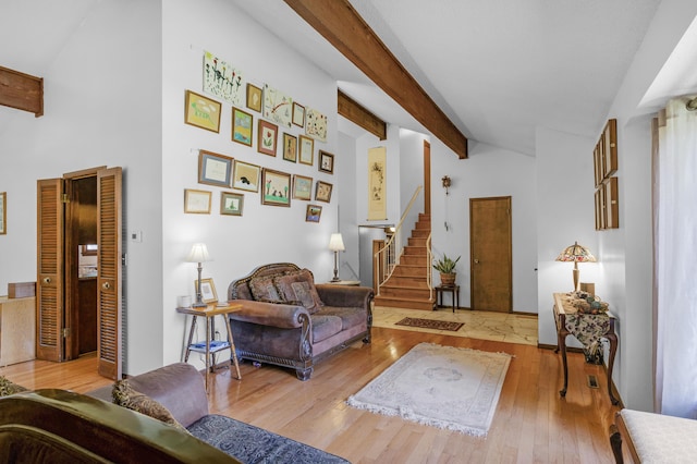 2941 S Versailles Ave, Springfield, MO 65804 - living room with stairs, lofted ceiling with beams, and hardwood / wood-style floors
