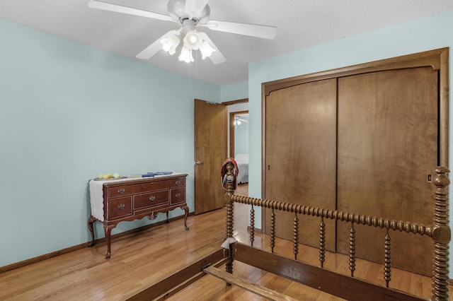 2941 S Versailles Ave, Springfield, MO 65804 - bedroom featuring baseboards, a closet, ceiling fan, and wood finished floors